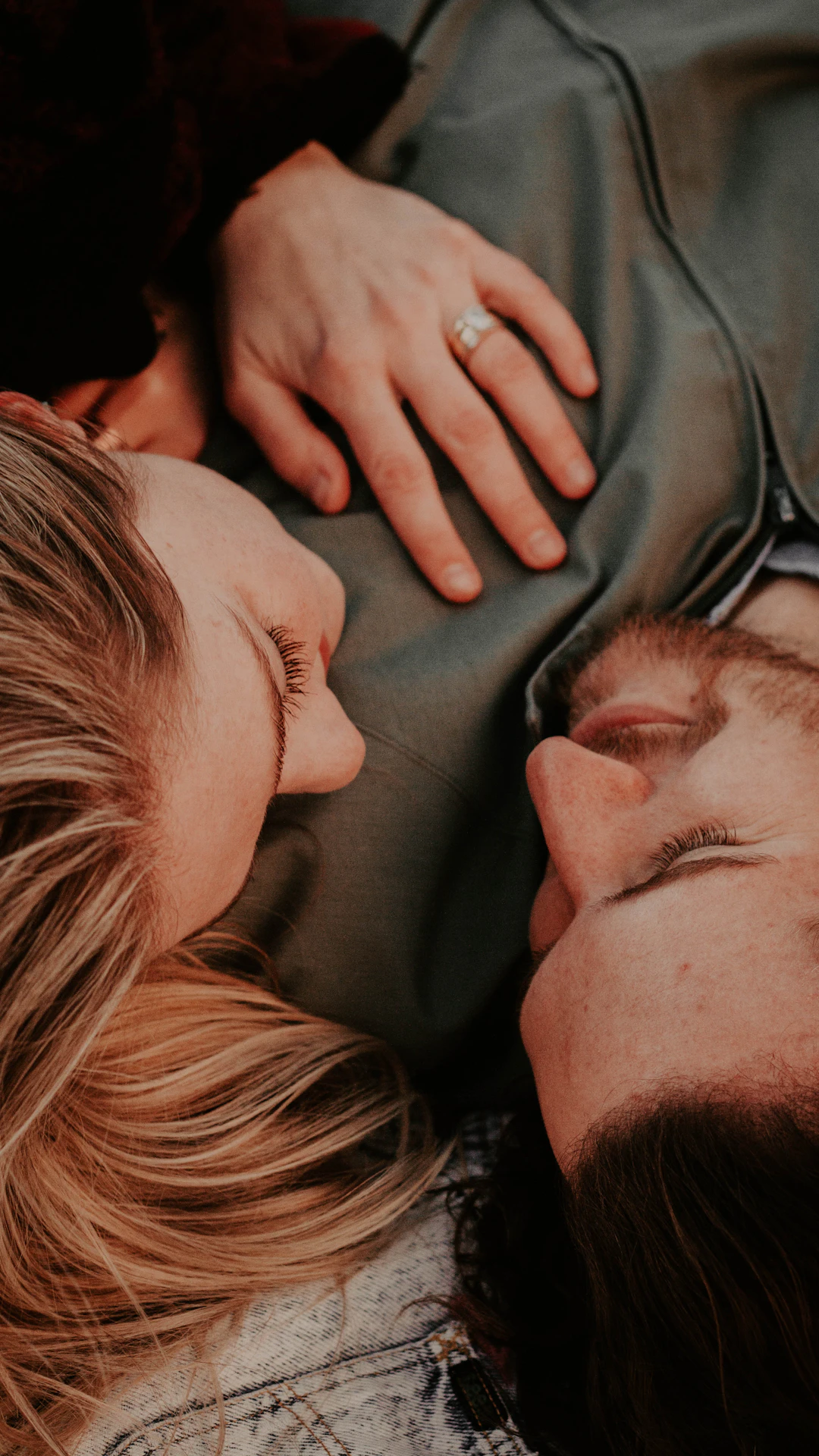 a woman stares into a man's eyes lovingly